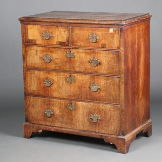 A Queen Anne pine and oak chest with oak top and pine linings, fitted 2 short and 3 long drawers 102cm h x 93cm w x 51cm d 