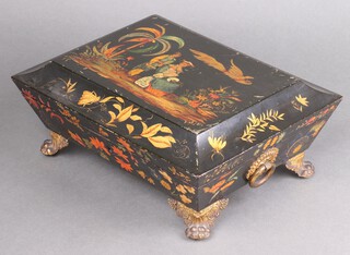 A 19th Century lacquered cushion shaped trinket box with gilt metal ring drop handles, raised on pressed metal paw feet, the lid decorated figures in a garden  bird with mythical 10cm x 29cm x 22cm 