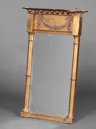 A rectangular Regency plate pier mirror contained in a gilt ball studded frame, the frieze decorated a garland 74cm x 46cm x 8cm 
