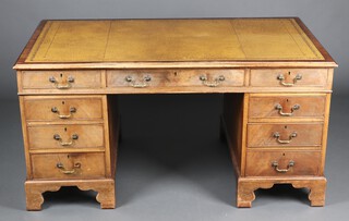 A 19th Century style bleached mahogany kneehole desk with green inset writing surface above 1 long and 8 short drawers 76cm h x 151cm w x 92cm d