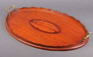 An Edwardian oval inlaid mahogany twin handled tea tray decorated a shell 4cm h x 59cm w x 38cm d 