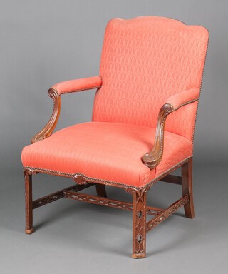 A 19th Century style mahogany open arm library chair, the seat and back upholstered in pink material with pierced H framed stretcher 98cm h x 69cm w x 59cm (seat 33cm x 36cm) 