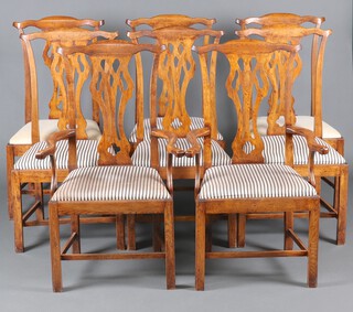 A set of 8 18th/19th Century oak Chippendale style dining chairs with pierced vase shaped slat backs and upholstered drop in seats, raised on square tapered supports with H framed stretchers, comprising 2 carvers 110cm h x 67cm w x 47cm d (seats 29cm x 30cm) and 6 standard chairs 109cm h x 56cm w x 46cm (27cm x 26cm) 
