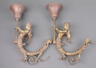 A pair of gilt metal wall light brackets supported by cherubs 33cm x 25cm (made up)