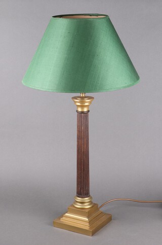 A turned and reeded mahogany table lamp, raised on a square stepped brass base 45cm h x 15cm 