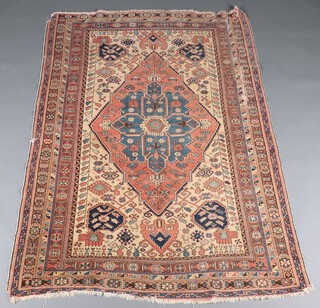 A light tan and blue ground Persian rug with diamond medallion within a multi row border 208cm x 140cm 