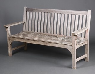 A well weathered slatted hardwood garden bench 92cm h x 160cm w x 59cm d 