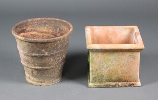 A well weathered circular terracotta garden plant pot of waisted form 36cm x 38cm together with a square ditto decorated pineapples 29cm x 35m x 35cm 
