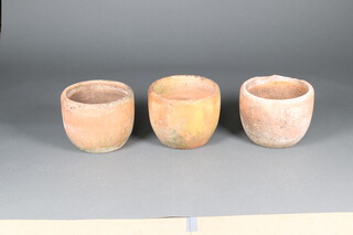 Three similar circular terracotta garden plant pots 28cm h x 37cm, 29cm x 36cm and 29cm x 37cm 
