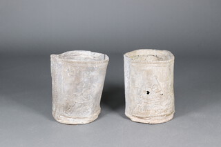 A pair of 19th Century circular cast lead garden planters with panelled decoration 44cm h x 35cm diam. 