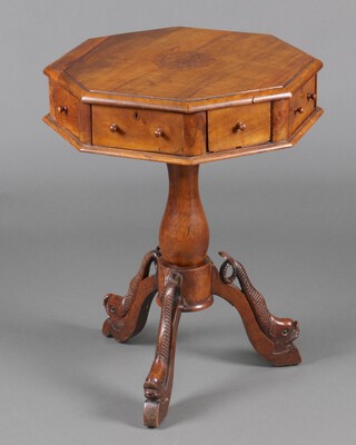 A 19th Century Continental octagonal  walnut drum table with inlaid octagonal panel to the top with wreath and lyre,  fitted 4 long and 4 short drawers, raised on bulbous turned column support with carved dolphin supports 73cm h x 55cm w x 54cm d 