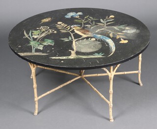 A 19th Century circular black marble pietra dura table with inlaid Cockatoo, moth, flowers and foliage raised on a gilt metal bamboo frame 46cm h x 89cm w