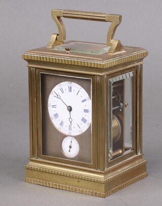 A 19th Century French 8 day carriage alarm clock with 6cm circular enamelled dial, Roman numerals, contained in a gilt metal case, back plate marked 5394, 14cm x 10cm x 9cm, complete with key, currently running