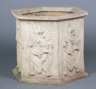A well weathered fibre glass, stone effect, hexagonal garden planter, the body cast griffins 53cm h x 57cm w x 65cm d 
