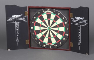 A Winmau dartboard and case 48cm x 45cm 