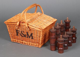 A Fortum & Mason woven willow picnic hamper basket 29cm h x 50cm w x 37cm d containing a collection of turned wooden terminals 