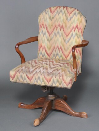 A Queen Anne style walnut revolving chair, raised on outswept supports 97cm h x 60cm w x 55cm d 