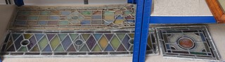 A collection of stained glass panels including 3 rectangular  panels 85cm x ???? (2 with broken glass), 2  95cm x 27cm (1 heavily damaged, 1 with cracked and missing panels) and 2  89cm x 27cm (both damaged) and 2 wedge shaped panels 37cm x 34cm (1 with damage) 