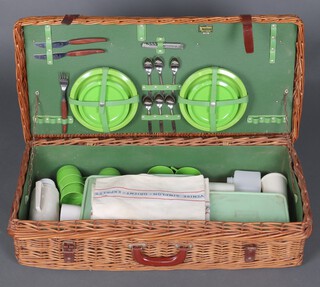 Asprey, a Brexton for Asprey, rectangular woven willow picnic hamper 20cm h x 79cm w x 37cm d containing chrome cutlery and plates