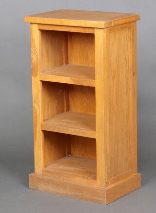 An oak open bookcase fitted 3 shelves, raised on a platform base 75cm h x 45cm w x 31cm d 