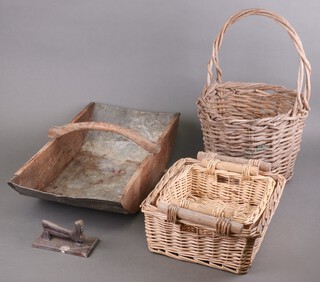 A zinc lined trug style basket 15cm x 57cm x 30cm, a circular woven willow basket 25cm x 30cm (old worm damage in places), 2 other willow baskets (worm in places), an iron door knocker in the form of a boot and a small collection of terracotta plant pots 