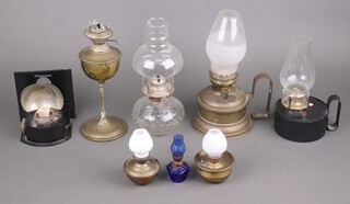 An Isaac Sherwood and Sons of Birmingham brass oil lamp (old solder repair), a Harvie & Co Patent oil lamp, 2 hand held lamps, a glass oil lamp and 3 miniature oil lamps 