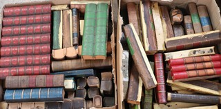 A large quantity of various of faux book binding fronts contained in a 3 boxes 
