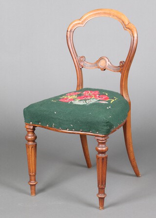 A Victorian bleached mahogany balloon back chair with carved mid rail and overstuffed seat, raised on turned and reeded supports (frame loose) 87cm x 45cm x 37cm 
