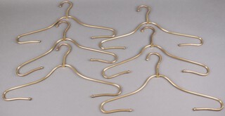 Six mid-century Italian gilt metal coat hangers 