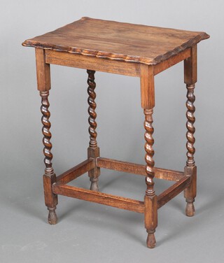 A 1930's rectangular oak occasional table with pie crust edge, raised on spiral turned supports 73cm h x 57cm w x 42cm d