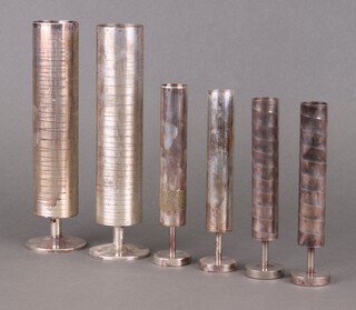 A pair of stylish mid-century silver plated cylindrical vases 22cm, a smaller pair 17cm and another pair 16cm 