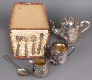 An Edwardian silver plated 3 piece tea set, a cased service and 2 silver spoons