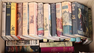 A collection of 1950's and 60's novels, all with dust jackets, contained in a cardboard box 