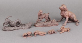 A composition figure of a seated hound 12cm and 6 other composition figures of dogs 