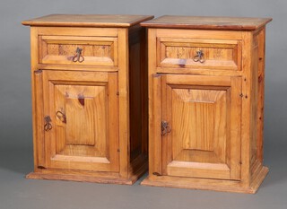 A pair of Mexican pine bedside cabinets fitted a drawer above panelled door 70cm h x 51cm w x 40cm d 