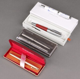 A gentleman's gold plated Sheaffer fountain pen with 14ct gold nib, boxed and with paperwork, a Parker 25 fountain pen and ballpoint and 2 other fountain pens 