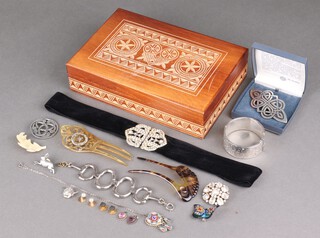 A silver bangle and a quantity of vintage costume jewellery, contained in a wooden box 