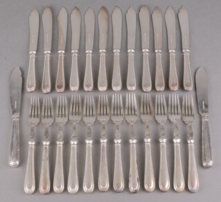 Twelve pairs of silver plated fish eaters 