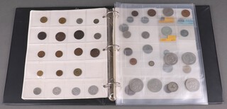 A 2002 uncirculated coin set, a 1994 ditto and a collection of foreign coins 