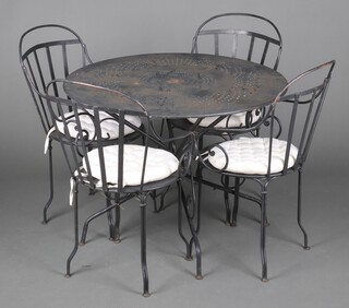 A pressed metal garden suite comprising circular table 72cm h x 96cm diam. together with 4 open arm chairs 