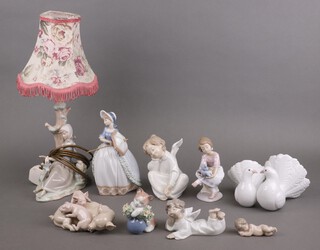 A Lladro group of a pig and piglets 17cm, 2 doves, a seated girl with teddybear, a sleeping cherub, sleeping angel, kitten (a/f), table lamp (a/f) and a seated angel (a/f)