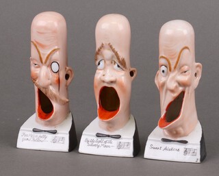 Three humorous Schafer and Vater bisque figure heads, raised on square bases 14cm 