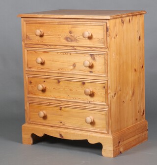 A pine chest of 4 drawers with turned handles 88cm h x 70cm w x 46cm d (water and contact marks in places) 