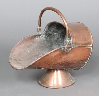 A Victorian copper helmet shaped coal scuttle with swing handle 30cm 