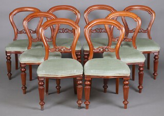 A set of 8 Victorian style carved and bleached mahogany balloon back dining chairs with carved and pierced mid rails, over stuffed seats, raised on turned and reeded supports 90cm h x 48cm w x 40cm d (seats 30cm x 33cm) 