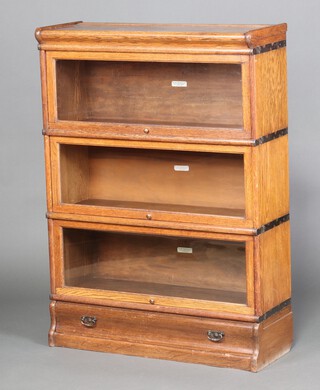 An oak 3 tier Globe Wernicke bookcase 119cm h x 86cm w x 31cm d 