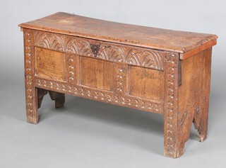 A 17th Century carved oak coffer with deep arcaded carved decoration to the front and shield shaped iron lock plate, the interior fitted a candle box and with iron loop hinges 58cm h x 75cm w x 37cm d 