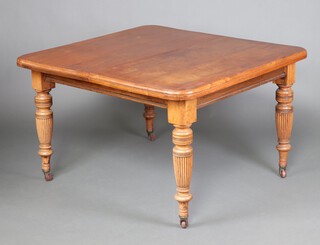 A Victorian mahogany extending dining table, raised on turned supports with ceramic casters together with 2 small extra leaves 76m h x 120cm  x 175cm l when fully extended 