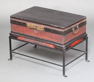 A late 19th Century rectangular Chinese lacquered trunk with hinged lid and gilt handles to the sides, raised on an associated later iron base 55cm h x 72cm w x 47cm d 