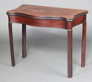 A Georgian mahogany inlaid and crossbanded tea table of serpentine outline, raised on square reeded supports 73cm h x 87cm w x 46cm d  